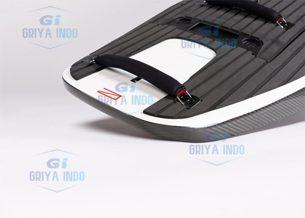 AWAKE RÄVIK S electric surfboard resting on the beach, ready for launch
